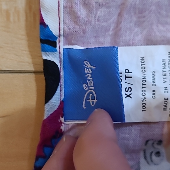 Disney women's size XS scrub top - Picture 2 of 4